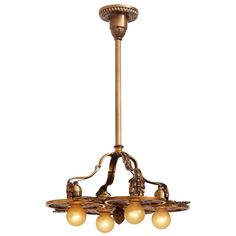 an antique chandelier with five lights hanging from it's center pole and four bulbs