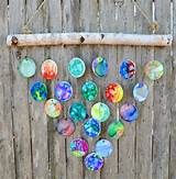 a wooden fence with glass balls hanging from it