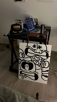 a laptop computer sitting on top of a wooden table next to a bag filled with stuff