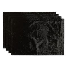 five black velvet place mats on a white background