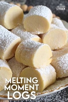 the cover of melting moment logs is shown with powdered sugar cubes on top