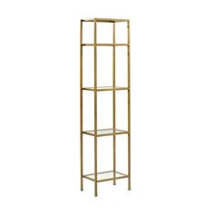 a tall gold metal shelf with glass shelves