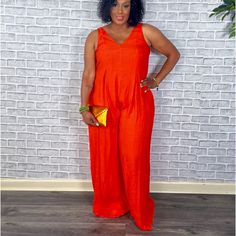 Follow The Rules Vibrant Orange Sleeveless Jumpsuit Step Into Confidence With This Striking, Vibrant Orange Jumpsuit. Designed For The Bold And Beautiful, This Sleeveless Piece Features A Flattering V-Neckline And A Flowing, Wide-Leg Silhouette That Ensures Comfort And Ease Of Movement. The High-Quality Fabric Offers A Luxurious Feel Against The Skin While Maintaining A Chic And Polished Appearance. Color: Vibrant Orange Neckline: V-Neck Sleeves: Sleeveless Leg Style: Wide-Leg Material: High-Qua Summer Orange Sleeveless Jumpsuits And Rompers, Sleeveless Orange Jumpsuits For Summer, Sleeveless Orange Jumpsuits And Rompers For Vacation, Chic Orange Sleeveless Jumpsuits And Rompers, Golden Clutch, Orange Jumpsuit, Festival Pants, Floral Print Pants, Statement Accessories