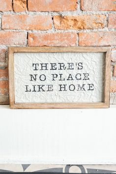 there is no place like home sign on the wall