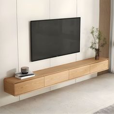 a flat screen tv mounted to the side of a wall