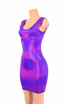 "This item is made to order, please read all the way through the listing before purchasing! This dress is made of a grape purple holographic spandex, with AMAZING shine! The deep purple reflects liquid fuchsia rainbows all over your curves, accentuating every move you make! It features a scoop tank style neckline in front and back.. It is made of four way stretch lycra spandex, and it fits like a glove! Super figure flaunting and fun! LENGTH: 27\" (from the underarm to the hemline) Womens Sizing Purple Stretch Bodycon Party Dress, Iridescent Fitted Mini Dress, Purple Bodycon Dress For Club, Shiny Sleeveless Fitted Bodycon Dress, Purple Sleeveless Bodycon Dress For Club, Purple Fitted Bodycon Dress For Club, Purple Fitted Bodycon Dress, Sleeveless Iridescent Mini Dress, Fitted Purple Bodycon Dress For Club