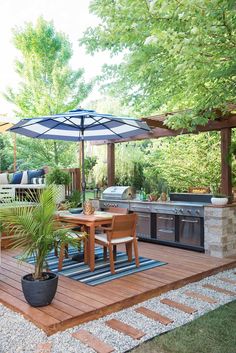 an outdoor kitchen and dining area is shown in this backyard garden design with wood decking