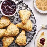 pastries on a wire rack with jam and butter