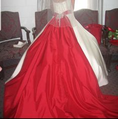 a woman in a red and white wedding dress