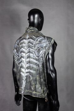 A minimalist post-apocalyptic vest for the men who don't like to look too flashy and prefer a solid yet unique style. Dark, menacing, with metal decorative elements made by hand by a blacksmith. Tt's a comfortable design that will look great for everyday wear with a solid black t-shirt, or as a LARP or scenic outfit with some more detailed components! All of our clothes are handmade, which is why individual pieces may slightly differ from those shown in the photos. If you can't find your size or would like to customize this product according to your preferences, please don't hesitate to contact us. MORE APOCALYPTIC CLOTHES AND ACCESSORIES AT: https://www.etsy.com/shop/WastedCouture ------------------------------ Wasted Couture - WastedCouture Wear if you dare! Edgy Halloween Streetwear Vest, Biker Sleeveless Vest For Festivals, Biker Style Sleeveless Vest For Festivals, Halloween Festival Sleeveless Vest, Edgy Halloween Vest For Alternative Fashion, Sleeveless Halloween Festival Vest, Sleeveless Vest For Halloween Festival, Sleeveless Biker Vest For Alternative Fashion, Alternative Style Halloween Streetwear Vest