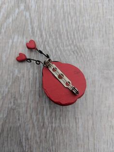 This adorable brooch features a cherry red resin ladybug with a black resin head. Its characteristic spots are in the shape of black hearts, and it has spiraling metal antennae tipped with red hearts. The piece is in great condition. The resin shows minor wear consistent with vintage jewelry. The pin mechanism is fully functional. Take advantage of free domestic shipping! Valentine's Day Gift Brooch Pins, Red Brooch Pins For Valentine's Day, Red Pins For Valentine's Day Gift, Heart-shaped Pins For Valentine's Day Gift, Black Eyed Susan Flower, Black Hearts, Black Resin, Moon Glow, Red Hearts