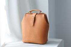 "Product Description * Material: vegetable tanned leather * Color: Hand-dyeing -Chocolate * Flap over entry with push lock * Add one zipper on the side, you can get small things through it without opening the bag * Weight：950g * Sewn by hand; * Size: 290mm (H) x 260mm (W) x 140mm (D) / 11.4\" x 10.23\" x 5.51\" * * * * * * * * * * * * * * * * * * * * * * * * * * * * * * * * * * * * * * * * * * * * * * * * * * * * * * * * *  About the production process of our product. 1. The vegetable tanned lea Brown Leather Backpack With Smooth Grain, Everyday Brown Vegetable Tanned Leather Backpack, Brown Vegetable Tanned Leather Backpack For Daily Use, Daily Use Brown Vegetable Tanned Leather Backpack, Brown Leather Satchel Backpack With Smooth Grain, Brown Vegetable Tanned Leather Satchel Backpack, Brown Vegetable Tanned Leather Backpack, Brown Smooth Grain Leather Backpack, Picture Doctor