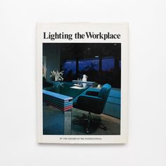 the cover of lighting the workplace, with a blue chair and table in front of it