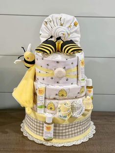 a diaper cake made to look like a bee and some honeycombs on it