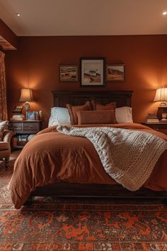 a large bed sitting in a bedroom next to two lamps