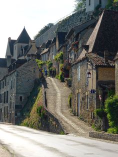 an old town with cobblestone streets and stone buildings on the side of it