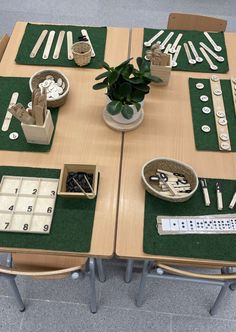 a wooden table topped with lots of utensils