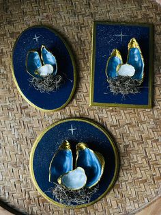 three plates with blue and gold designs on them