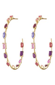 Multicolor crystals in a variety of faceted cuts bring vibrant sparkle to slim hoop earrings rendered from polished 14-karat gold. 2" hoop diameter; 1/8" width 14k gold/pink sapphire Made in the USA Pink Sapphire Hoop Earrings, Crystal Goddess, Crystal Hoop Earrings, Curator Style, Pink Sapphire, Eden, Sapphire, Jewelry Earrings, Hoop Earrings