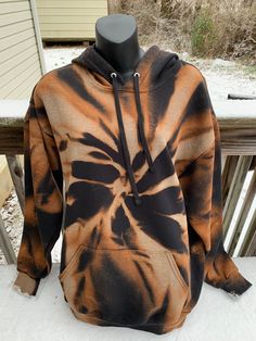 This hoodie actually came about accidentally. I'm glad it did because I have had such a good response to this orange bleached hoodie online that I decided to post it to my shop! :)  Each reverse tie dye hoodie is 60% cotton and 40% polyester.  The brand I use for these hoodies are The Fruit of The Loom EverSoft.  Fruit of the Loom fleece is made with EverSoft ring spun cotton for premium softness wash after wash.  This great fleece collection offers a variety of great benefits to keep you feeling comfortable and confident.  The wicking and odor protection benefits will help keep you feeling fresh. Stay confident knowing that Fruit of the Loom is working to keep you feeling comfortable.  Two-piece hood for a better fit and front pouch pocket for comfort and versatility. Double-needle stitch Trendy Acid Wash Hooded Hoodie, Trendy Acid Wash Sweatshirt With Drawstring Hood, Trendy Tie-dye Sweatshirt For Winter, Trendy Tie Dye Sweatshirt For Winter, Trendy Tie Dye Sweatshirt For Streetwear, Cotton Tie Dye Hoodie For Winter, Trendy Tie-dye Hoodie For Winter, Tie Dye Cotton Hoodie For Winter, Trendy Tie Dye Hoodie For Winter