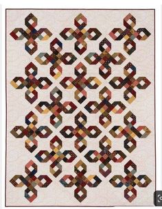 a quilt made with squares and circles