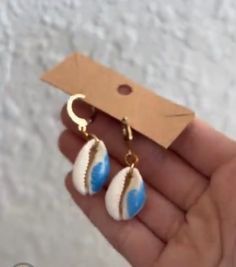 These shell earrings are an amazing beachy girl staple with its hand painted wave on a beachy cowri shell! Please keep in mind these can tarnish is worn in water so I would avoid it if possible! BOUGHT AND LOVE IT? Please write a review as it helps customers feel satiated purchasing!💓 Handmade Blue Summer Jewelry, Handmade Summer Blue Jewelry, Trendy Earrings For Beach Season, Trendy Earrings For The Beach Season, Ocean-inspired Shell Earrings As Gift, Handmade Ocean Color Jewelry For Summer, Beach Jewelry For Pierced Ears, Shell-shaped, Handmade Ocean Color Summer Jewelry, Summer Shell Jewelry For Gifts