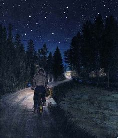 a man riding a bike down a road at night with the stars in the sky