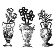 three vases with designs on them sitting next to each other