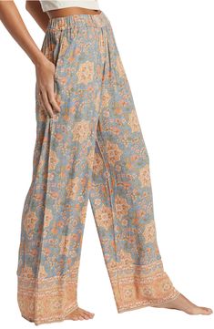 Feel the breeze in these flowy crinkle-textured pants covered in a lively print with contrasting borders. 28" inseam Elastic waist Side-seam pockets 100% viscose Machine wash, tumble dry Imported Casual Boho Print Pants For Vacation, Casual Boho Print Pants, Patterned Wide Leg Bottoms With Pockets, Vacation Rayon Bottoms With Pockets, Patterned Wide Leg Beach Bottoms, Casual Printed Rayon Bottoms, Patterned Wide Leg Bottoms With Elastic Waistband, Printed Wide-leg Rayon Bottoms, Casual Multicolor Rayon Bottoms