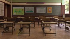 an empty classroom with desks and chairs