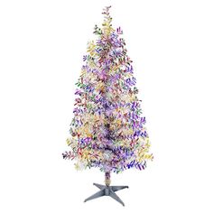 a multicolored christmas tree on a stand with star decorations in the shape of flowers