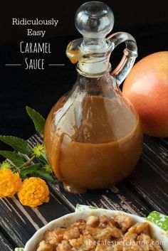 caramel sauce in a bowl next to an apple and another fruit on the table