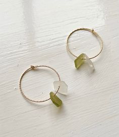 A delicate pair of hoop earrings finished with hand picked sea glass. Hoops - 25mm wide These hoops are available in sterling silver and gold filled. These hoops are completely customisable with choices of metal, the colour of sea glass, how many pieces of sea glass and where the sea glass came from. No two pieces of jewellery are exactly alike due to them being handmade, making the more unique! Minimalist Nickel Free Sea Glass Jewelry, Silver Sea Glass Earrings For Gift, Silver Hypoallergenic Earrings With Sea Glass, Handmade Sea Glass Drop Earrings, Minimalist Nickel-free Sea Glass Jewelry, Nickel-free Adjustable Sea Glass Earrings, Blue Sea Glass Nickel-free Earrings, Hoops Gold, Sea Glass Earrings