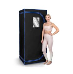 a woman standing in front of a black and blue portable storage unit with her hands on her hips