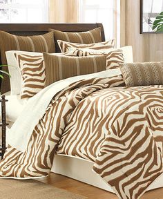 a zebra print comforter set on a bed