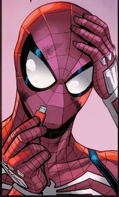 a spider - man holding a cell phone to his ear