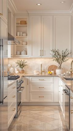 a kitchen filled with lots of white cabinets and counter top space next to an oven