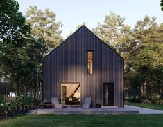 the house is made out of wood and has two windows on one side, and an open floor plan