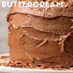 a close up of a cake on a plate with the words buttercream over it