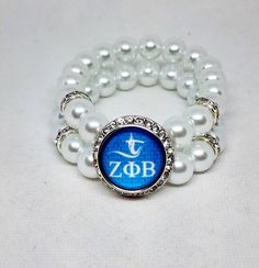 Zeta Phi Beta snap charm bracelet Bracelet will beaded with 10mm WHITE beads Made to order stretch bracelet Small, medium, large, XL Adjustable Beaded Stretch Bracelet In Pearl White, Adjustable Pearl White Beaded Stretch Bracelet, Adjustable Pearl White Stretch Bracelet With Round Beads, Adjustable Pearl White Jewelry With 8mm Beads, White Stackable Stretch Bracelet, Nickel Free White Stretch Bracelet As Gift, Nickel-free White Stretch Bracelet As Gift, Adjustable White Stretch Bracelet, Nickel Free, Nickel-free White Stretch Bracelet Gift