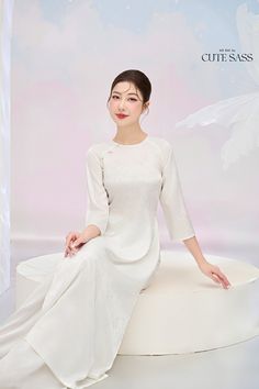 "\"Tinh\": white, pure, elegant \"Kỳ\": sophisticated \"Tinh Kỳ\" collection centers around white áo dài, featuring designs ranging from simple to sophisticated. Whether you need a white áo dài for a casual or special occasion, there is one for you. Each design embodies so much detail to create a style that is both subtle and distinctive. As always, our focus lies on elegance, quality, and size inclusivity.  ❣️ This set includes one Ao Dai Top and Pants Style: Traditional  Material: Silk. Some Stretch  Models wear size S ❣️ Please note: - Sizing may run 1-2 sizes smaller than American standard sizes, please refer to the sizing charts for sizing. - Please contact me if you have any questions ❣️We are proud to provide you with the highest quality fabric, handpicked modest colors, wide-range Solid Color Sets For Spring Wedding, Elegant White Summer Sets, Elegant White Long Sets, Traditional Fitted White Ao Dai, White Wedding Sets For Spring, White Long Sets For Spring, Elegant Long White Ao Dai, White Long Wedding Sets, Fitted White Ao Dai For Summer