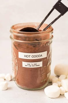 a jar filled with hot cocoa and marshmallows