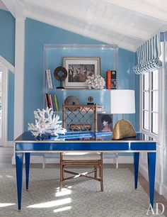 a blue table in the middle of a room