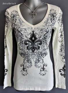 New Womens Vocal Apparel embellished ivory cotton long sleeve tee shirt Size Small This incredibly unique and rare Vocal shirt is just stunning Design on chest and cuffs are embellished with studs and crystals Ivory tone with black screen print and stones all over Just GORGEOUS Made in USA by Vocal Apparel This is one of my many HIGHLY sought after old school Vintage Vocal style tops! I have been selling Vocal clothing for 17 YEARS now and just LOVE this brand! Please see measurements 100% Ribbed Cotton - Has Light Stretch Measured without stretching - *Small - 13" armpit to armpit unstretched - shoulder to waist 25" BE VOCAL - STAND OUT IN A CROWD & PUT A GIRL IN IT before it's gone! XOXO Lisa - Put a Girl In It Bohemian Fitted Winter Tops, Fitted Bohemian Tops For Winter, Bohemian Fitted Crew Neck Top, Fitted Bohemian Crew Neck Top, Tattoo Long Sleeve, Angel Wings Tattoo, Biker Shirts, Wings Tattoo, Style Tops