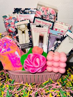 a basket filled with lots of different types of items and confetti on top of a table