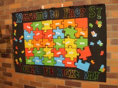 a sign that says welcome to prep sky with puzzle pieces on it in front of a brick wall