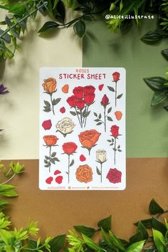 a sticker sheet with roses on it next to some green leaves and flowers in the background