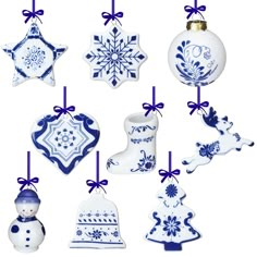 christmas ornaments are hanging from strings on a white background with blue bows and snowflakes