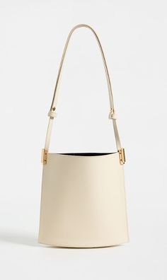 Find NEOUS Dorado 1.0 Shoulder Bag on Editorialist. Calfskin,Gold-tone hardware,Open top,Patch interior pocket,Suede lining,Weight: 10oz / 0.28kg,Made in Italy High-end Shoulder Bucket Bag With Gold-tone Hardware, Modern Shoulder Bag With Gold-tone Hardware, High-end Bucket Bag With Gold-tone Hardware And Top Handle, High-end Bucket Bag With Gold-tone Hardware, Modern Bucket Shoulder Bag With Brass Hardware, High-end Top Handle Bucket Bag With Gold-tone Hardware, High-end Beige Shoulder Bag With Gold-tone Hardware, Designer Bucket Bag With Gold-tone Hardware For Everyday, High-end Daily Use Bucket Bag With Gold-tone Hardware