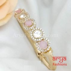 Minimalist 22 Karat Gold plated Kundan Bracelet with Colored Stones Made in Brass with 22 Karat Gold plating Thickness: Approx. 1 Inches Available in size 2.6. Openable Bracelet that can fit size 2.8 as well Lightweight Bracelet Pink Gold Plated Bracelets, Pink Metal Bracelets For Wedding, Pink Gold Bangle For Wedding, Jadau Bracelet, Kundan Bracelet, Bracelet Indian, Colored Stones, Special Deals, Gold Polish